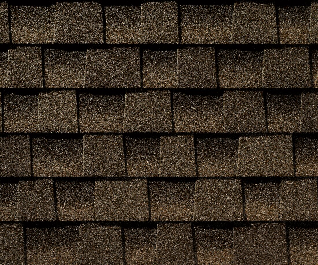 Close-up detail of GAF Timberline HDZ architectural asphalt shingles in Barkwood